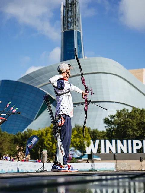 Archery competition, archer shooting