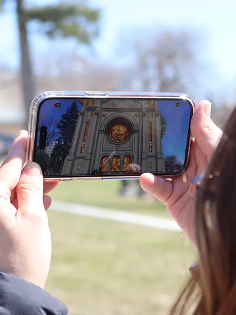 woman taking photo with smart phone